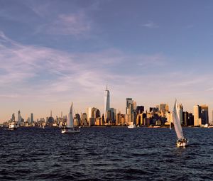 Preview wallpaper city, buildings, sailboat, water