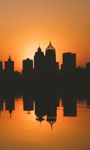 Preview wallpaper city, buildings, silhouettes, sunset, water, reflection, dark