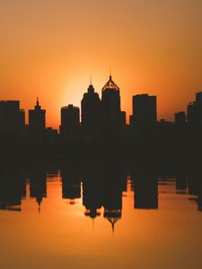 Preview wallpaper city, buildings, silhouettes, sunset, water, reflection, dark