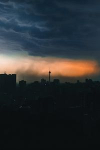 Preview wallpaper city, buildings, silhouettes, clouds, twilight, dark