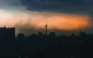 Preview wallpaper city, buildings, silhouettes, clouds, twilight, dark