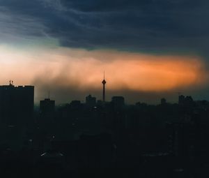 Preview wallpaper city, buildings, silhouettes, clouds, twilight, dark