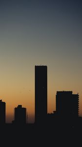 Preview wallpaper city, buildings, silhouettes, twilight, dark