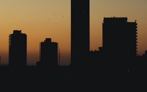 Preview wallpaper city, buildings, silhouettes, twilight, dark