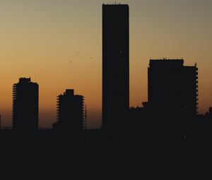 Preview wallpaper city, buildings, silhouettes, twilight, dark
