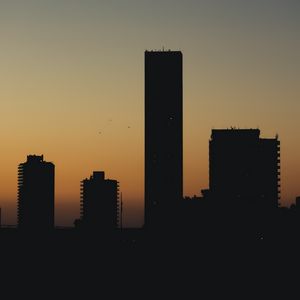 Preview wallpaper city, buildings, silhouettes, twilight, dark