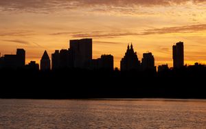 Preview wallpaper city, buildings, silhouettes, water, twilight, dark