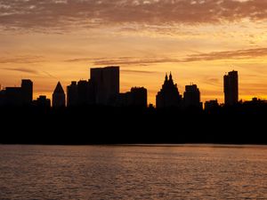 Preview wallpaper city, buildings, silhouettes, water, twilight, dark
