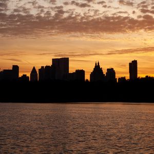 Preview wallpaper city, buildings, silhouettes, water, twilight, dark