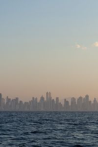 Preview wallpaper city, buildings, silhouettes, water, waves