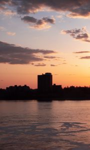 Preview wallpaper city, buildings, silhouettes, sunset, clouds, dark