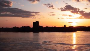 Preview wallpaper city, buildings, silhouettes, sunset, clouds, dark