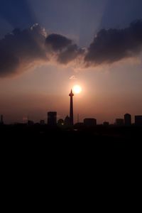 Preview wallpaper city, buildings, silhouettes, sun, twilight, dark