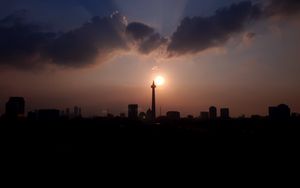 Preview wallpaper city, buildings, silhouettes, sun, twilight, dark