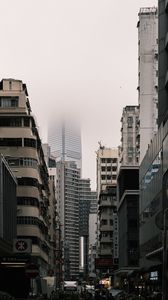 Preview wallpaper city, buildings, skyscraper, fog