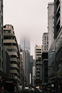 Preview wallpaper city, buildings, skyscraper, fog