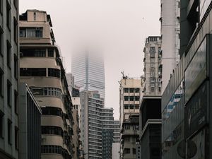 Preview wallpaper city, buildings, skyscraper, fog