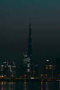 Preview wallpaper city, buildings, skyscraper, water, lights, night