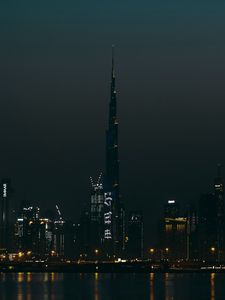 Preview wallpaper city, buildings, skyscraper, water, lights, night
