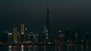 Preview wallpaper city, buildings, skyscraper, water, lights, night