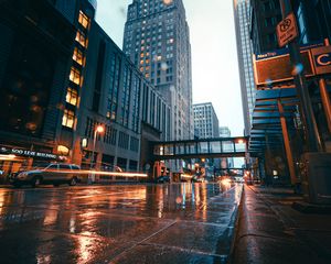 Preview wallpaper city, buildings, skyscrapers, road, rain