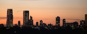 Preview wallpaper city, buildings, skyscrapers, water, evening