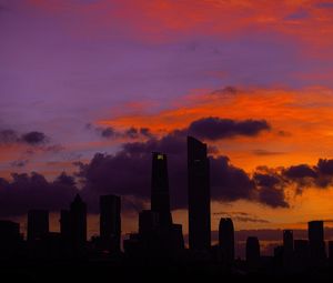Preview wallpaper city, buildings, skyscrapers, silhouette, sunset