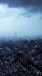 Preview wallpaper city, buildings, skyscrapers, fog, darkness