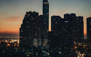Preview wallpaper city, buildings, skyscrapers, dusk, evening