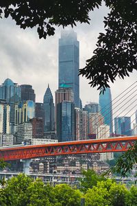 Preview wallpaper city, buildings, skyscrapers, bridge, trees, view