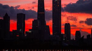 Preview wallpaper city, buildings, skyscrapers, dusk, sunset, dark