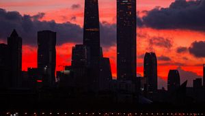 Preview wallpaper city, buildings, skyscrapers, dusk, sunset, dark
