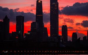 Preview wallpaper city, buildings, skyscrapers, dusk, sunset, dark
