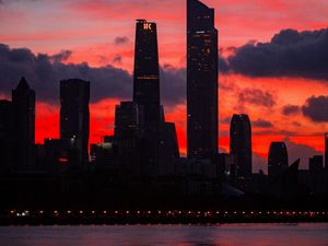 Preview wallpaper city, buildings, skyscrapers, dusk, sunset, dark