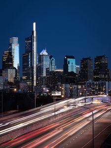Preview wallpaper city, buildings, skyscrapers, road, night, lights