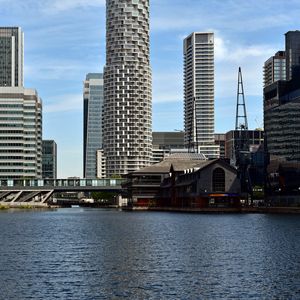 Preview wallpaper city, buildings, skyscrapers, river, water