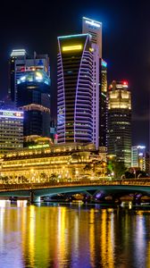 Preview wallpaper city, buildings, skyscrapers, backlight, water, night
