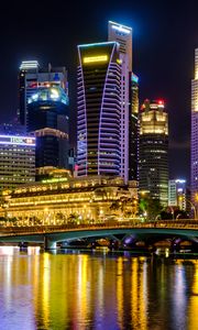 Preview wallpaper city, buildings, skyscrapers, backlight, water, night
