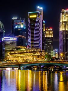 Preview wallpaper city, buildings, skyscrapers, backlight, water, night