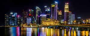 Preview wallpaper city, buildings, skyscrapers, backlight, water, night