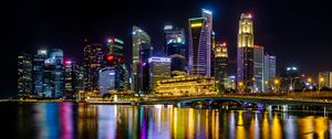 Preview wallpaper city, buildings, skyscrapers, backlight, water, night