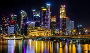 Preview wallpaper city, buildings, skyscrapers, backlight, water, night