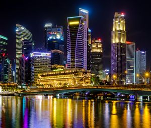 Preview wallpaper city, buildings, skyscrapers, backlight, water, night