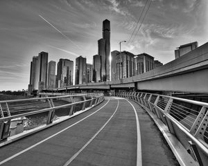 Preview wallpaper city, buildings, skyscrapers, walkway, black and white