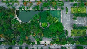 Preview wallpaper city, buildings, street, park, trees, aerial view