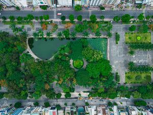 Preview wallpaper city, buildings, street, park, trees, aerial view