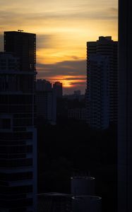 Preview wallpaper city, buildings, sun, sunset