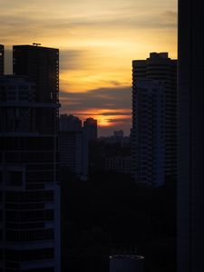 Preview wallpaper city, buildings, sun, sunset