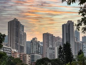 Preview wallpaper city, buildings, trees, sunset