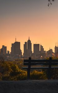 Preview wallpaper city, buildings, trees, bench, twilight